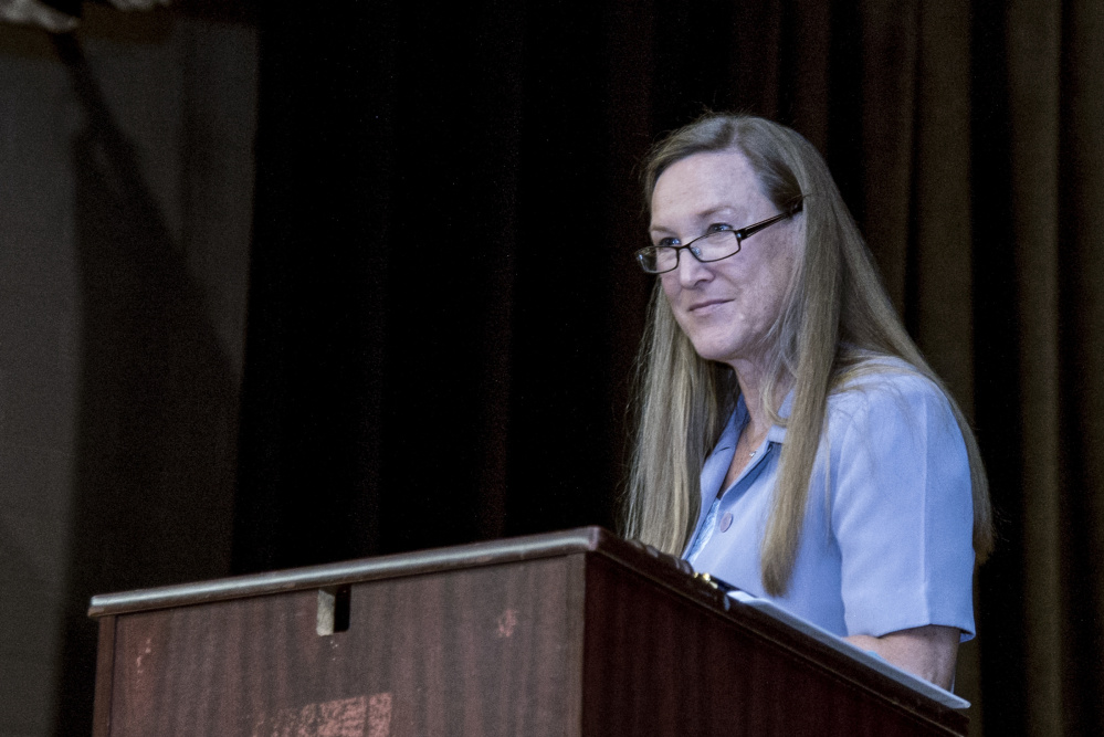 Mary Dennison moderates Farmingdale's Town Meeting on Saturday. The vent was held at Hall-Dale High School in Farmingdale.