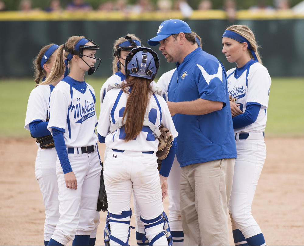 Kevin Bennett photo 
 Madison head coach Chris LeBlanc has a talk with his team during the sixth inning as they trail Bucksport 2-1 in the Class C state championship game Saturday in Brewer.