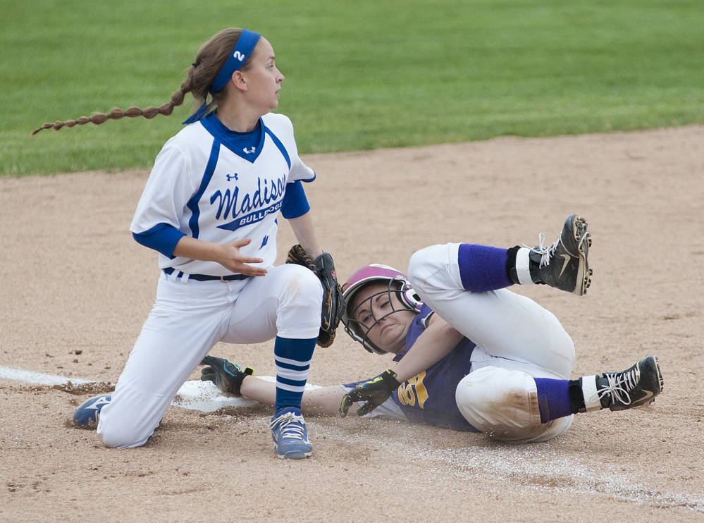 Kevin Bennett photo 
 Madison's Annie Worthen tags Bucksport runner Kylee Atwood out as she was caught off third base during fifth inning in the Class C state championship Saturday in Brewer.