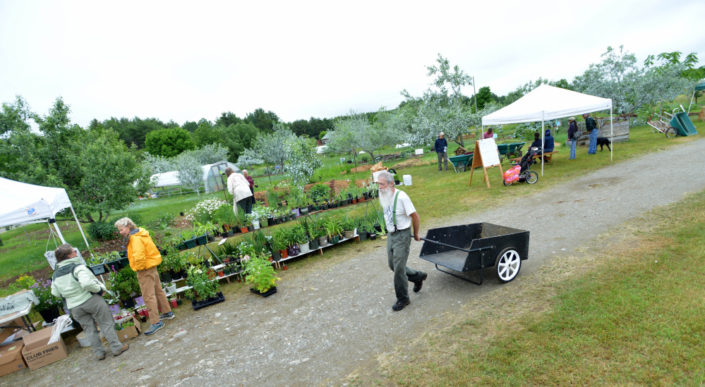 People browse among the demonstrations and products on display Saturday at the annual Maine Organic Farmers and Gardeners Association farm and homestead day workshops in Unity.
