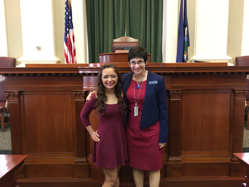 Kristen Pooler, 20, of Gardiner, left, sang the national anthem June 6 on the floor of the Maine House of Representatives during the opening ceremonies. She was welcomed to the State House by Rep. Gay Grant, D-Gardiner.