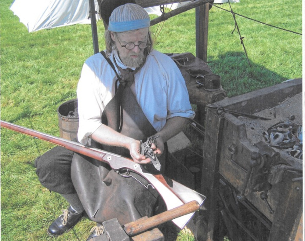 Blacksmith Jeff Miller works at his temporary forge.