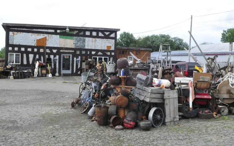 Used household items are stacked in front of the 201 Antiques store in Fairfield on Wednesday.