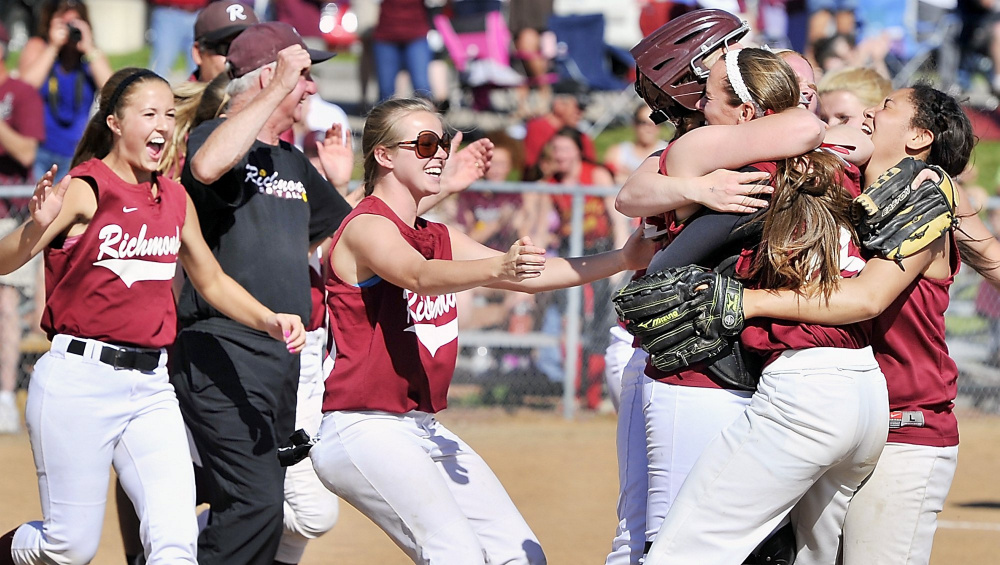 On Saturday, June 15,  2013, Richmond players celebrate the win with catcher, Chika Obi and pitcher, Jamie Plummer, starting it with a hug as the Richmond Bobcats and the Penobscot Valley Howlers played in the final for the Class D State Softball Championship at St. Joseph's College in Standish.