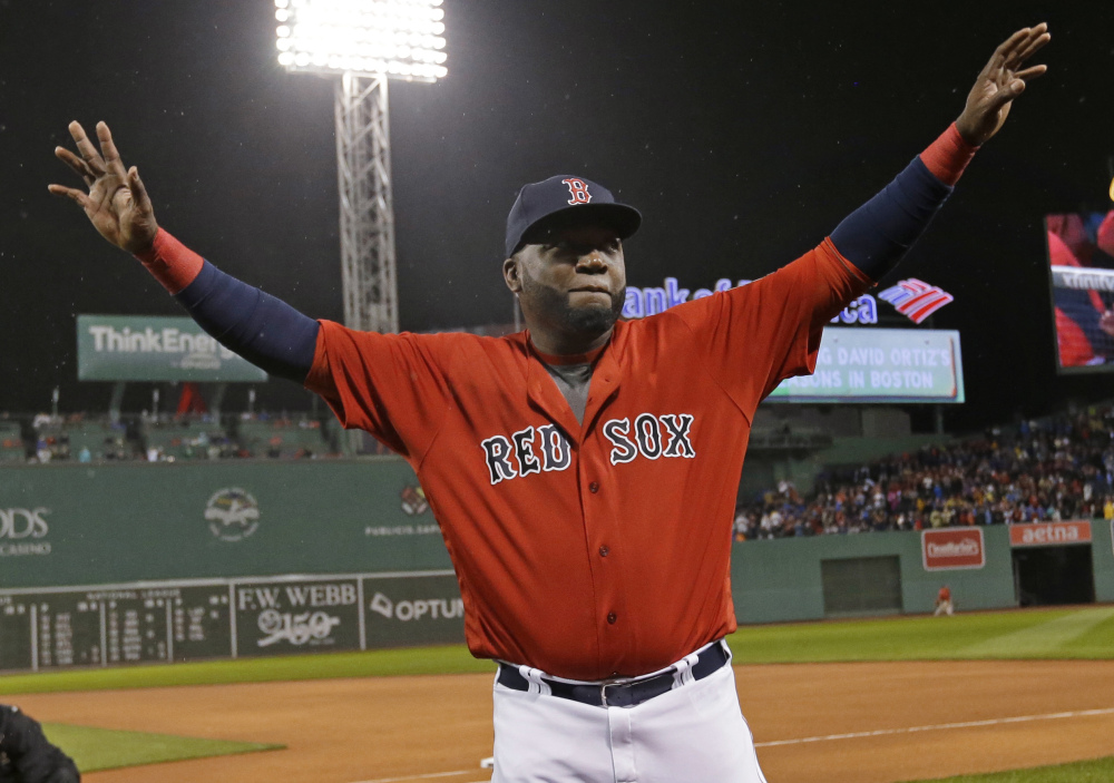In this Sept. 30, 2016 photo, Boston Red Sox designated hitter David Ortiz waves to fans as he is honored before the a game against the Blue Jays at Fenway Park in Boston.