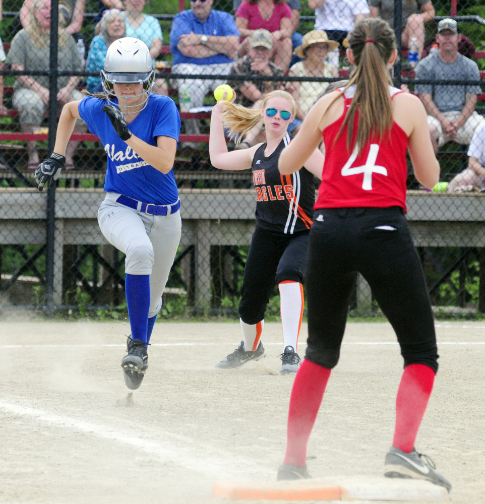 After laying down a bunt, Valley's Michaela Marden, left, sprints to first during the Class C/D senior all star game Thursday in Augusta. She beat the throw from Limestone pitcher Delaney Rossignol, center, to Central first baseman Emma Campbell.