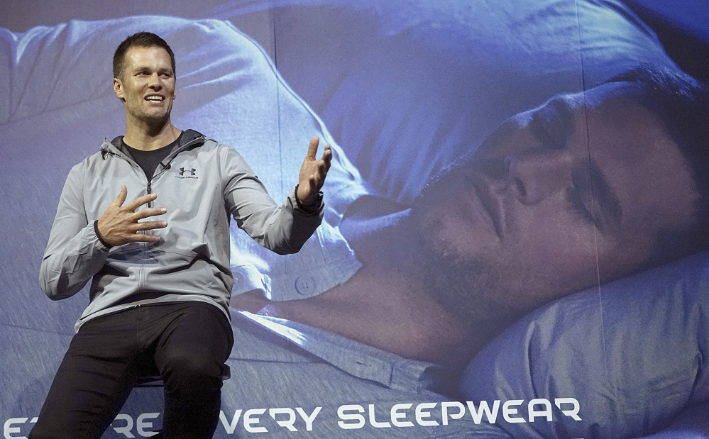 New England Patriots quarterback Tom Brady gestures during a promotional event Thursday in Tokyo. The Super Bowl-winning quarterback is on a week long promotional tour of China and Japan for a sportswear maker.