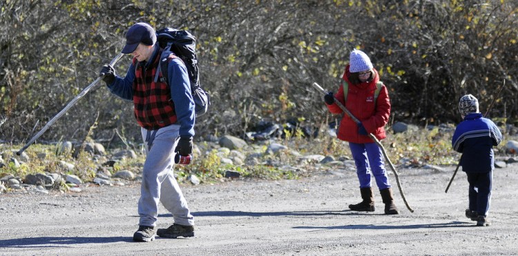 Matthew Perry emerges Nov. 19, 2014, from the Bond Brook Recreation Area with his daughter, Annmarie, 10, and son, Andrew, 4. The recreation area in Augusta will receive grant money to help improve the infrastructure at the park.