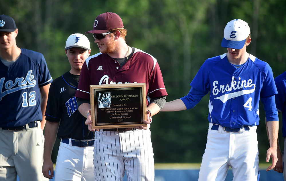 Orono's Jackson Coutts holds the Dr. John Winkin Award after receiving it following the Class C and D All-Star game Friday at Colby College in Waterville.