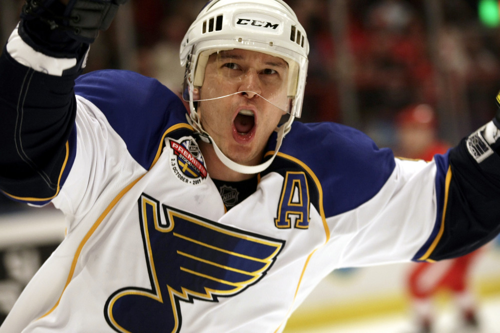 In this Oct. 2, 2009 photo, St. Louis Blues forward Paul Kariya reacts after scoring his second goal during a game against Red Wings in Stockholm. Kariya was selected to the Hockey Hall of Fame on Monday.