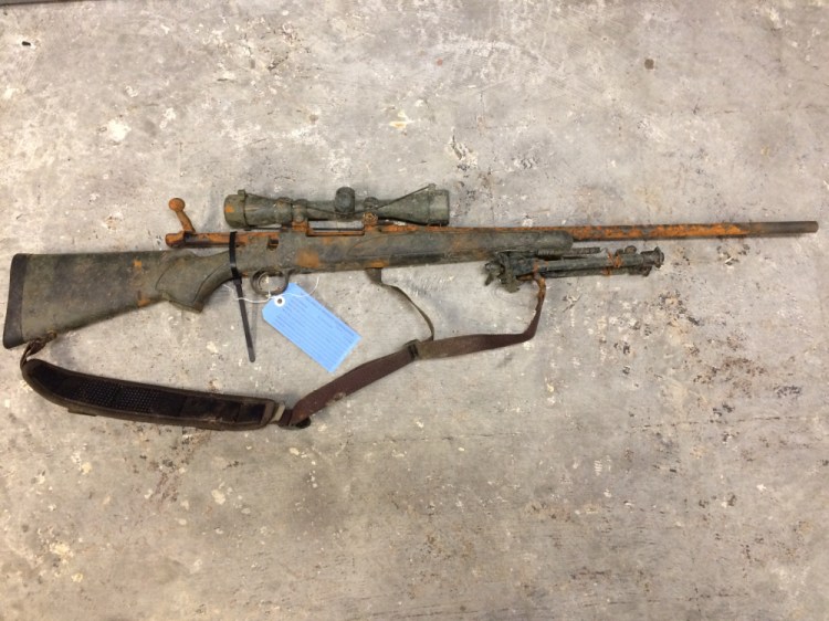 A father and son who were fishing in the Kennebec River in Augusta on Sunday pulled up this rifle from the river, police said.