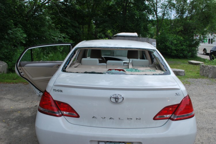 A bicyclist went through this car window Tuesday on Water Street.