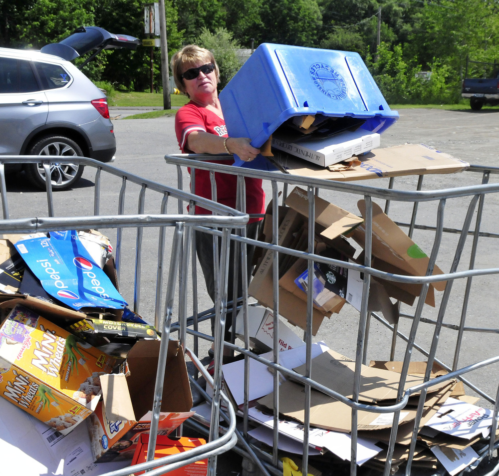 Doris Smith unloads cardboard in the appropriate bin Thursday at the Waterville Recycling Center on the Armory Road in Waterville.