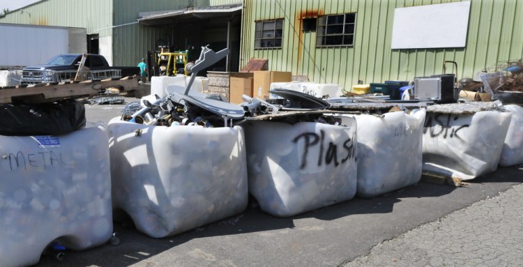 Residents take recycling items and deposit them in appropriate containers Thursday at the Waterville Recycling Center on the Armory Road in Waterville.