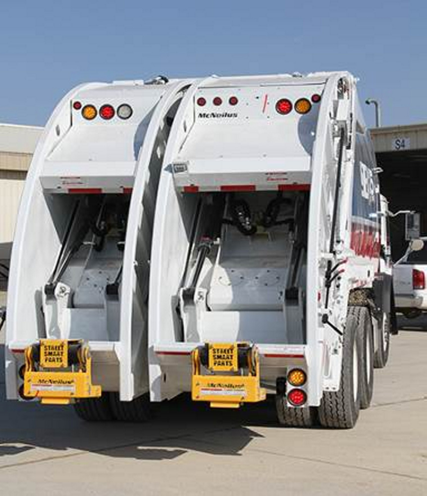 This is an example of a split packer truck that can take both recyclables and trash.