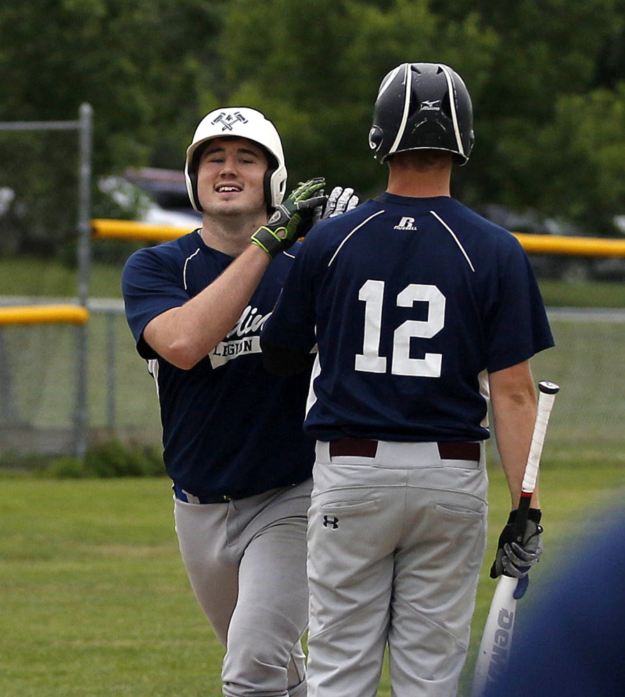 Gardiner's Ryan Kappelmann is congratulated at home plate after hitting a home run against Augusta in the first inning of an American Legion baseball game Thursday in Augusta.