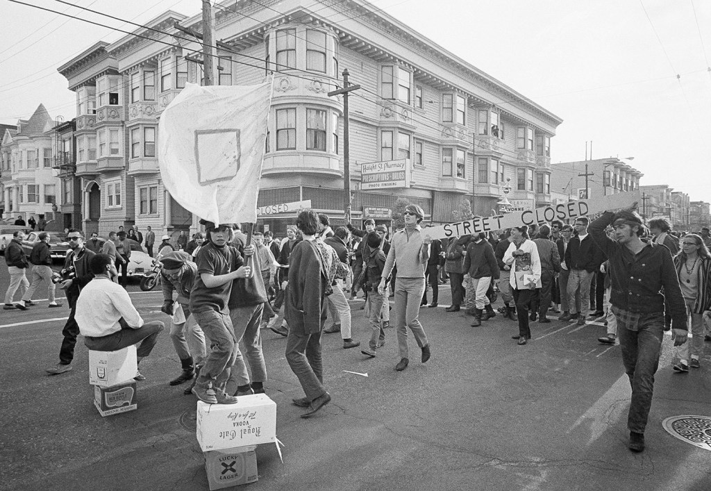 People parade up and down the streets of the Haight-Ashbury district in San Francisco on April 3, 1967, to resist the Vietnam War and 1960s American orthodoxy.