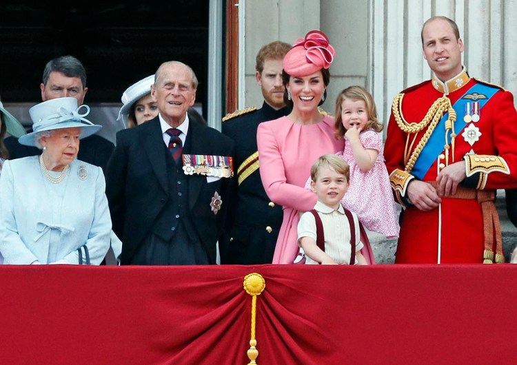 Members of the British royal family – from left, Queen Elizabeth II, Prince Philip, Prince Harry, Princess Kate, The Duchess of Cambridge, with children Prince George and Princess Charlotte and Prince William – gather on the balcony of Buckingham Palace, after attending the annual Trooping the Colour Ceremony in London on Saturday. 