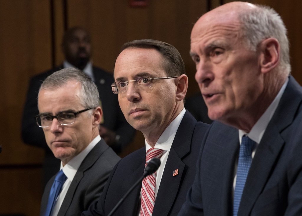 From left, acting FBI Director Andrew McCabe, Deputy Attorney General Rod Rosenstein, and Director of National Intelligence Dan Coats testify before a Senate Intelligence Committee hearing about the Foreign Intelligence Surveillance Act, on Capitol Hill on Wednesday.