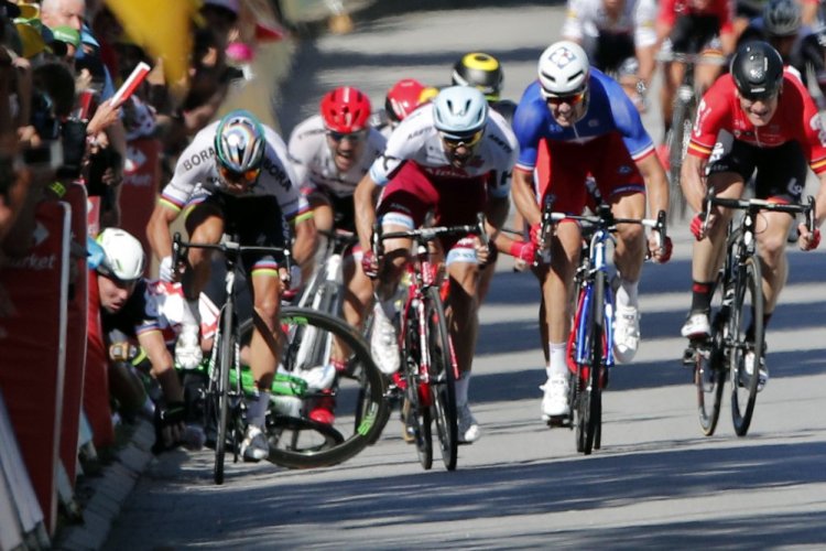 Britain's Mark Cavendish crashes during the sprint of the fourth stage of the Tour de France.