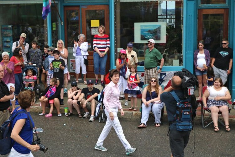 Sen. Susan Collins, R-Maine, marches in Eastport's parade Tuesday. "There was only one issue," she said, of her constituents' focus on health care. 