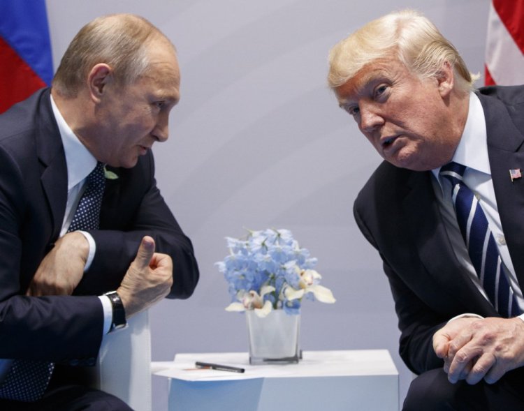 President Trump says he "strongly pressed" Russian President Vladimir Putin twice Friday about meddling in the election, but Trump has not said whether he believes Putin's denial.