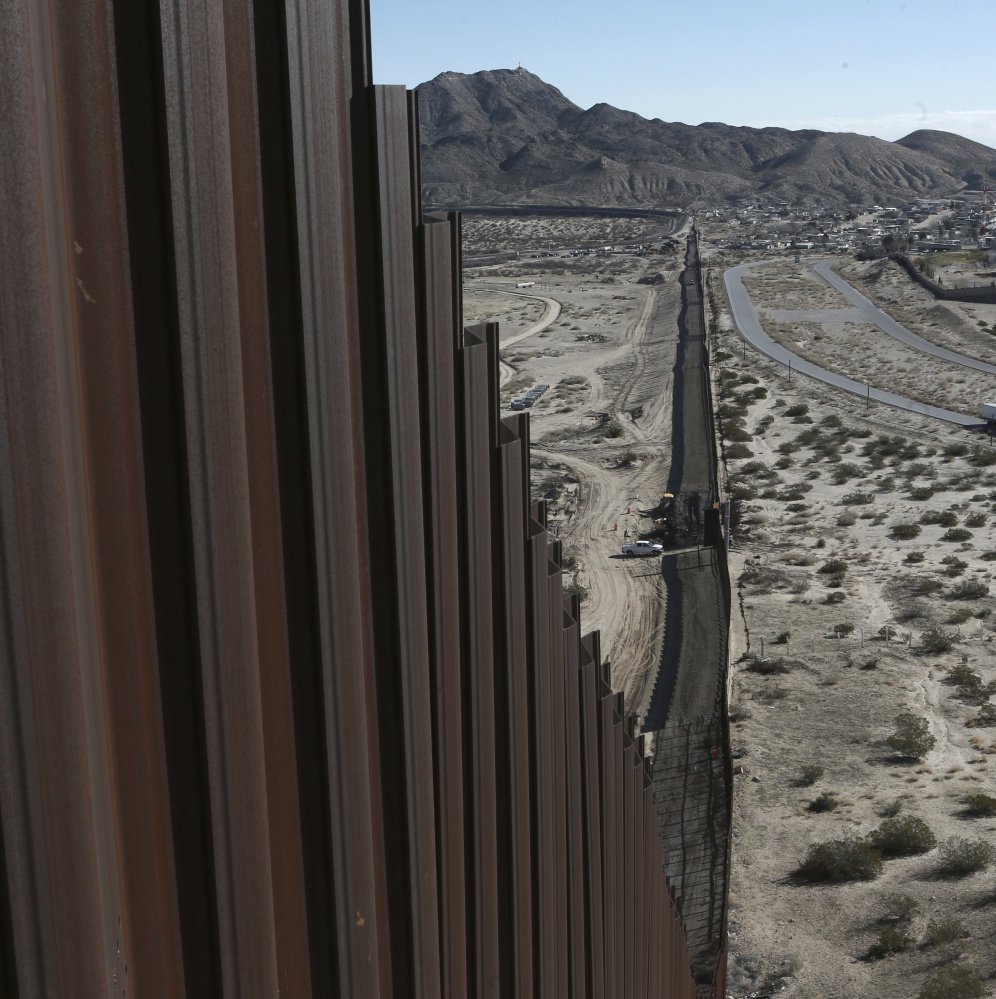 Part of the current Mexico-U.S. border fence disappears into the horizon in Sunland Park, New Mexico.