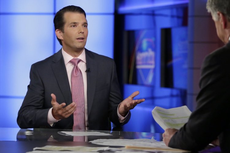 Donald Trump Jr., left, is interviewed by host Sean Hannity on his Fox News Channel television program, in New York. Donald Trump Jr. eagerly accepted help from what was described to him as a Russian government effort to aid his father's campaign with damaging information about Hillary Clinton, according to emails he released publicly on Tuesday.