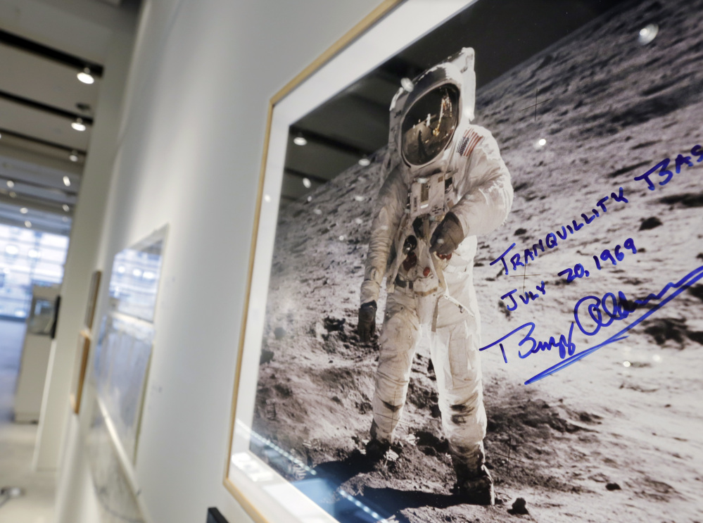 A print of astronaut Neil Armstrong's photograph of Apollo 11 astronaut Buzz Aldrin standing on the moon, to be offered at auction at Sotheby's, is displayed in New York.