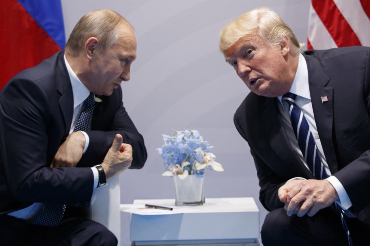 President Trump meets with Russian President Vladimir Putin at the G-20 summit on July 7 in Hamburg. The two also had a previously undisclosed hourlong conversation at the summit, a White House spokesman says.