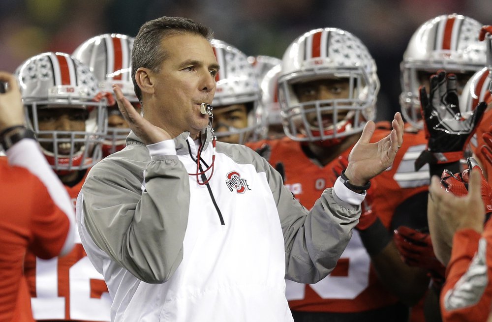 Ohio State head coach Urban Meyer rallies his players before the NCAA college football playoff championship game in 2015. 
