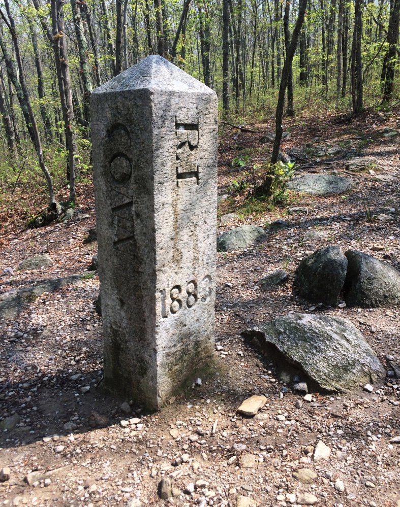 An obelisk marks where Connecticut, Massachusetts and Rhode Island meet in Thompson, Conn. "As soon as you see that thing, you're hooked," Brian Butler said.