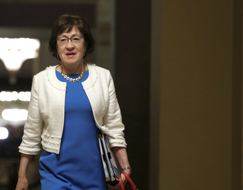 Senator Susan Collins walks to the Senate floor before a vote on the health care bill on Capitol Hill in Washington late Thursday night, July 27. 