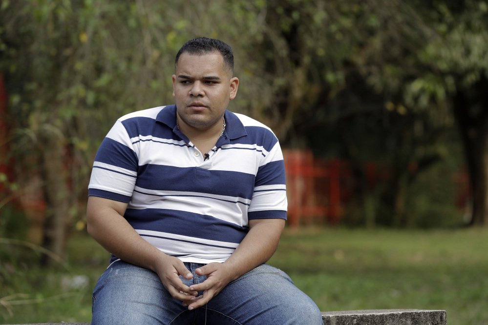 In this Sunday, May 28, 2017 photo, Calebe Correa de Souza, a former member of the Rhema Community Evangelical Ministry, speaks during an interview in Franco da Rocha, Brazil, in the greater Sao Paulo area. His father, Flavio Correa said Calebe, his oldest son, was slapped so many times during a blasting session by pastors at the Word of Faith Fellowship's Franco da Rocha church that he suffered several cuts on his face. (AP Photo/Andre Penner)