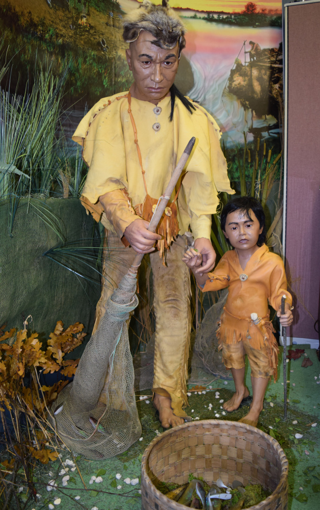 Mannequins as part of the "Remembered Vision" exhibit at the Vassalboro Historical Society depict a native fisherman and his son on the Cates Farm site in Vassalboro.