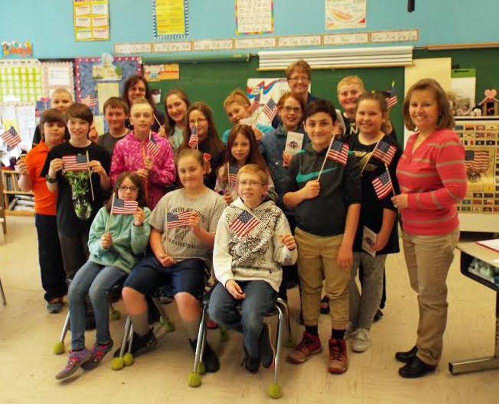 Liberty Day presentation participants, front from left, are Riley Trask, Jaydn Pingree, Jonah Moore and Caden Adams. Second row, from left, are Joseph Christian, Aubrey Kachnovich, Mia Henry, Avalyn Roy, Miranda Smiley, Kathryn Dorey and Susan Sandler, teacher. Third row, from left, are Ben Simard, Ares Ayer, Ian York, Rep. Tina Riley, Leah Burgess, Izzabella Curtis, Lyn Jellison and Robbie Bamford.