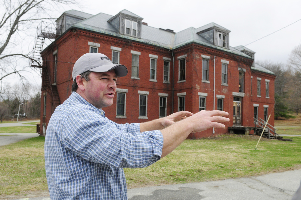 Developer Matt Morrill leads a tour of the Stevens Commons in Hallowell in April shortly before voters approved bond money for infrastructure improvements at the complex.