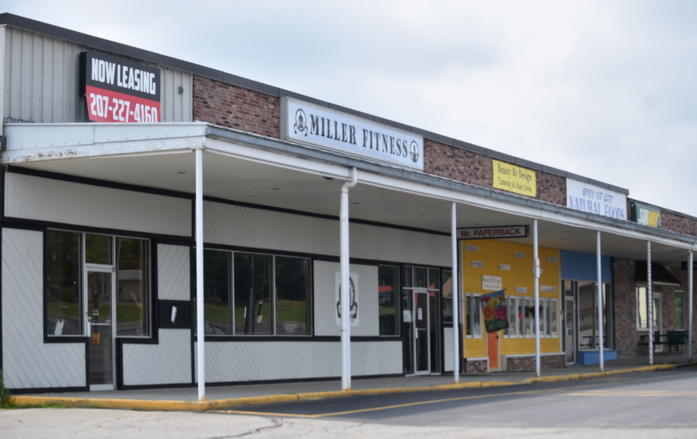 A vacant space borders Miller Fitness on Friday at the Skowhegan Plaza.
