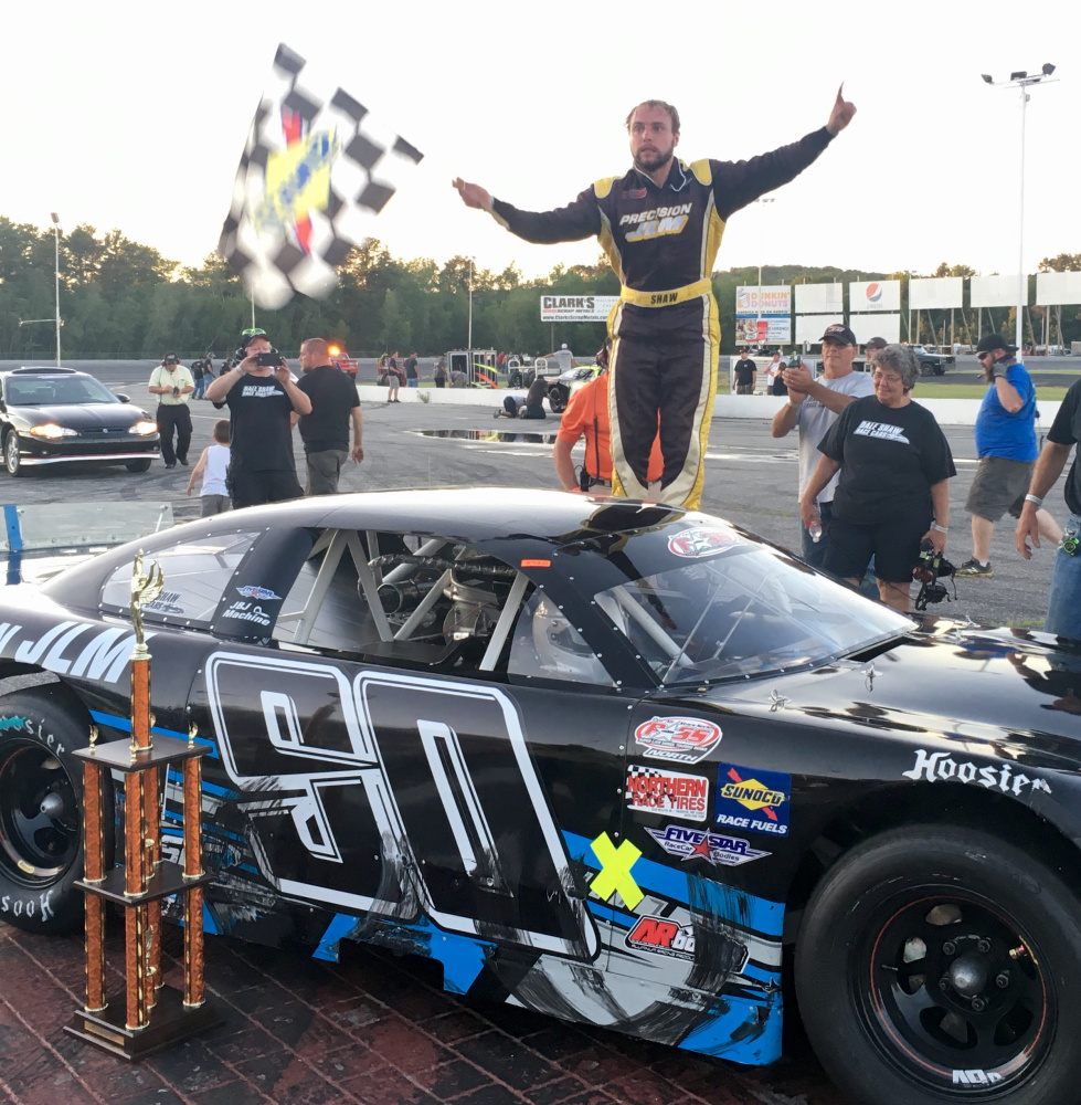 D.J. Shaw of Center Conway, New Hampshire, celebrates after winning the PASS Open 100 on Sunday at Oxford Plains Speedway.