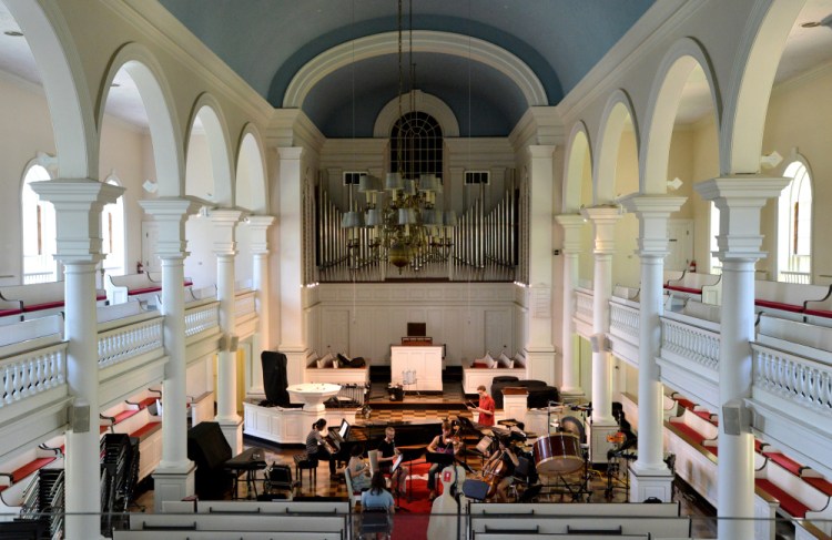 College and postgraduate students rehearse Thursday for the Atlantic Music Festival in Lorimer Chapel at Colby College.