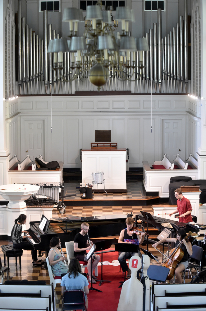 College and postgraduate students rehearse Thursday for the Atlantic Music Festival in Lorimer Chapel at Colby College.