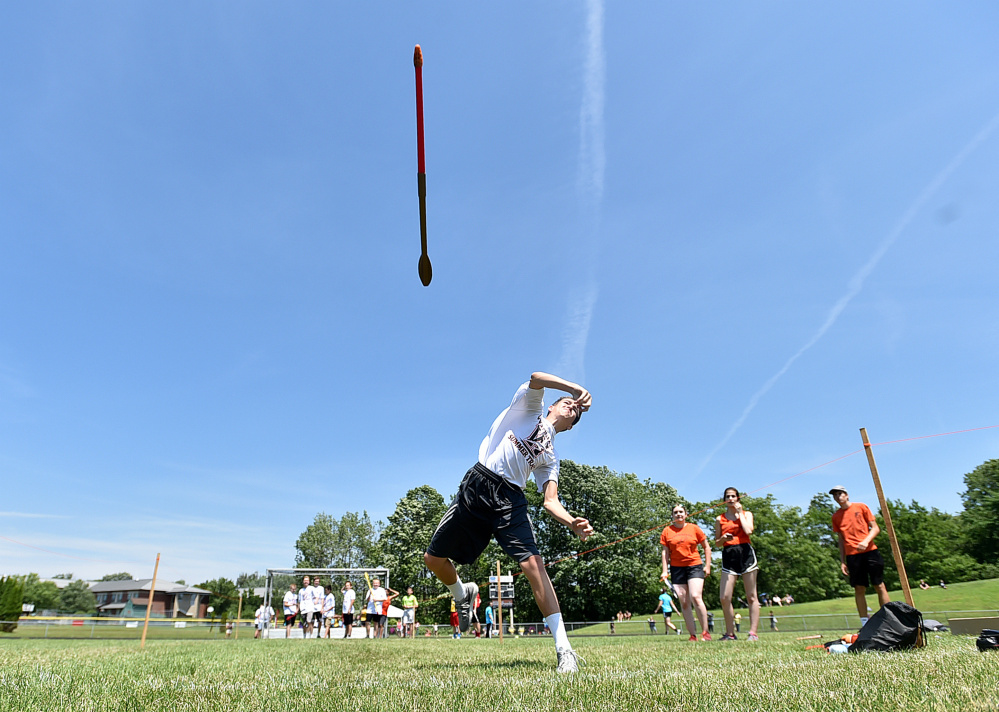 Trey Goodwin, 14, of Winslow, competes in the javelin during a youth summer track meet Thursday at Winslow High School.