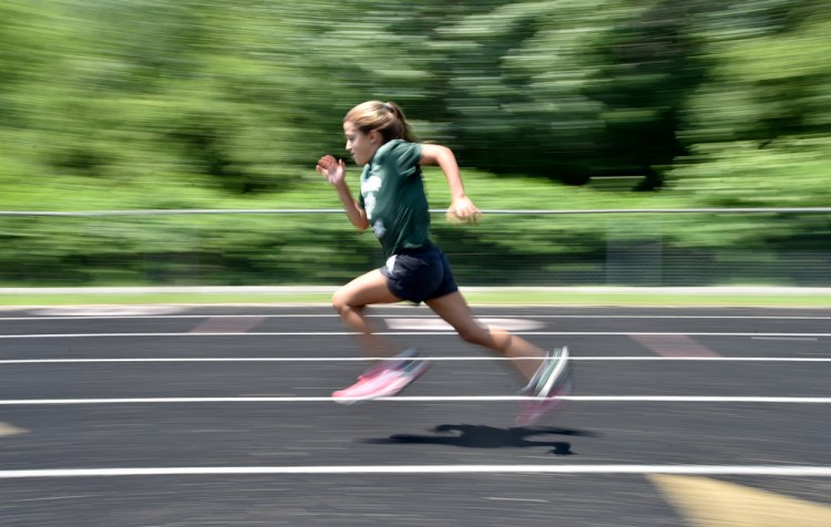 Winthrop's Georgette Brown competes in the 200-meter dash at a youth summer track meet Thursday at Winslow High School.