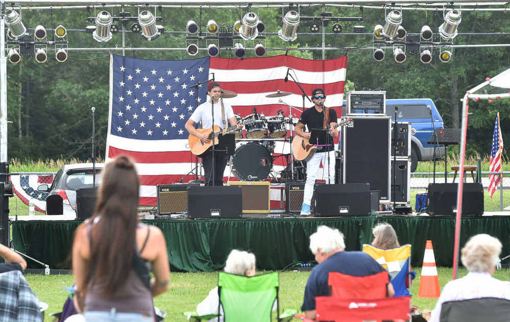 Dylan Brann and Nick Colizzi perform on Tuesday at the Central Maine 4th of July Celebration in Clinton.