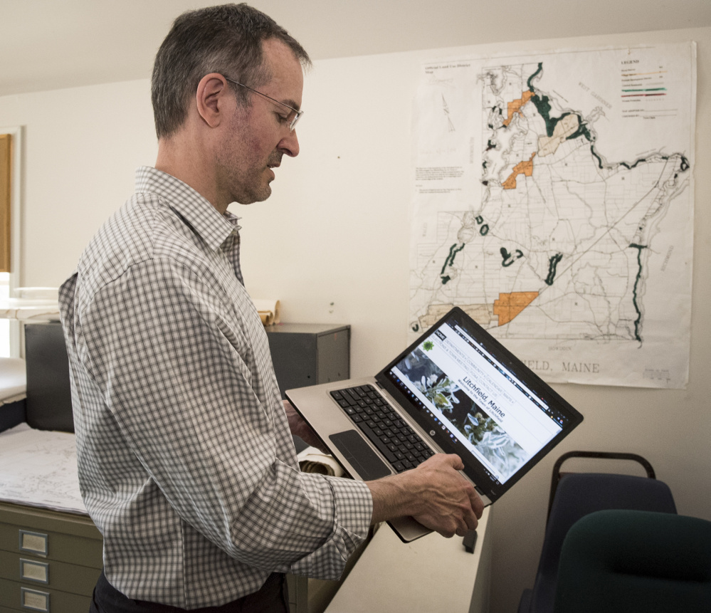 Kelly Weissenfels, toggles through the town of Litchfield's website Thursday. Weissenfels is both the web tech and part-time town clerk in Litchfield. He is working on making improvements to the town's website.