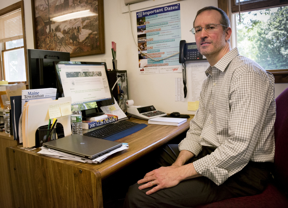 Town of Litchfield web technician and part-time Town Clerk Kelly Weissenfels works Thursday on making changes and improvements to the town's website after voters approved funding to upgrade the site.