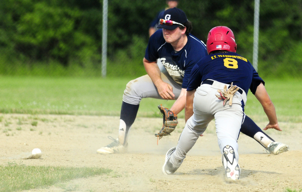 Gardiner infielder Ryan Kappelmann, left, waits for a throw as Augusta baserunner Justin Rodrigue slides safely into second during an American Legion Zone 2 game against Gardiner on Tuesday at Hoch Field in Gardiner.