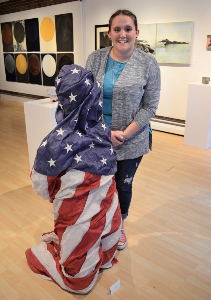 Liza Stratton, of South Portland, tied with Abe Goodale ,of Camden, for the People's Choice Award at the end of Art2017, the Harlow Gallery's 22nd annual juried show, for her mixed media sculpture "freedom."