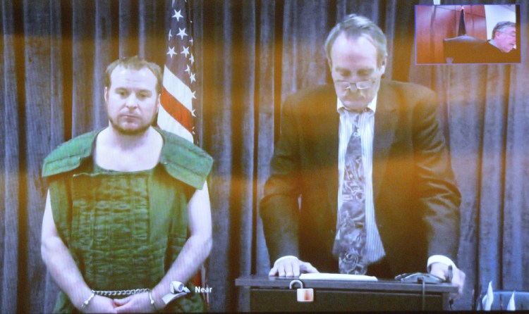 Jeremy Clement, left, and his attorney, Steve Bourget, appear on video from the Kennebec County jail during his initial appearance April 21 at the Capital Judicial Center in Augusta.