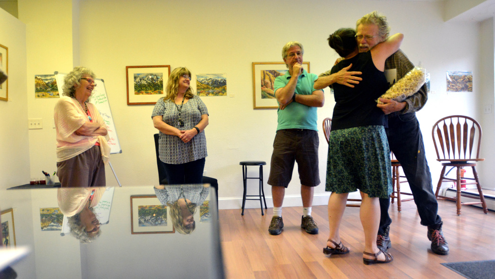 People gather at Skowhegan's newest art venue, Fourteen Madison, on Wednesday to plan for Wesserunsett Arts Council's annual Open Studio Tour, which will be held Aug. 12 this year, and not in October as in previous years.